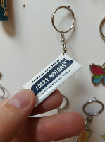 Брелок из полимерной смолы, двухсторонний на пластике, размер 2.5х5см Брелок из полимерной смолы, двухсторонний на пластике, размер 2.5х5см